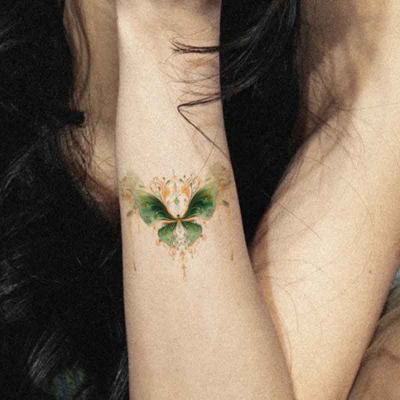 Green butterfly tattoo
